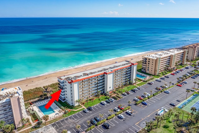 drone / aerial view with a view of the beach and a water view