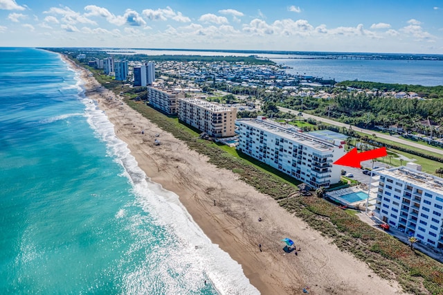 aerial view featuring a view of the beach and a water view