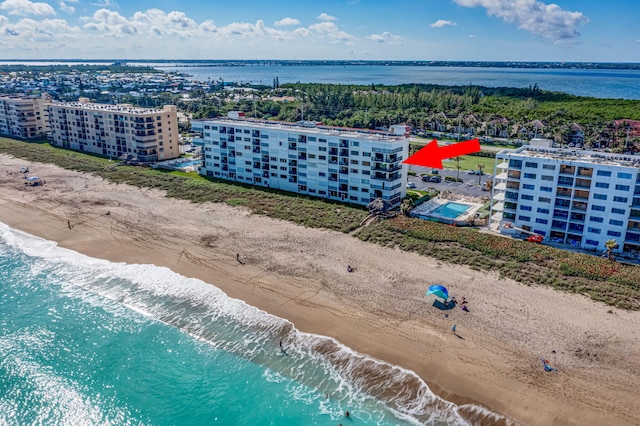 aerial view with a view of the beach and a water view