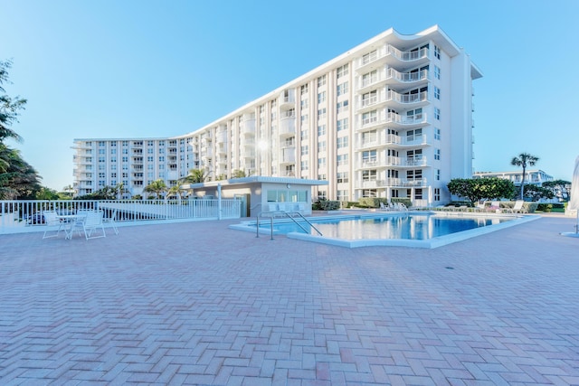 view of swimming pool featuring a patio area