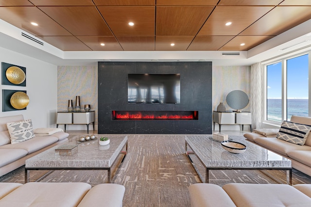 living room with a premium fireplace and wood ceiling