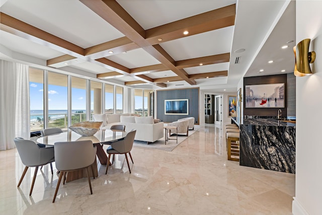 dining room featuring beam ceiling, a water view, expansive windows, and coffered ceiling