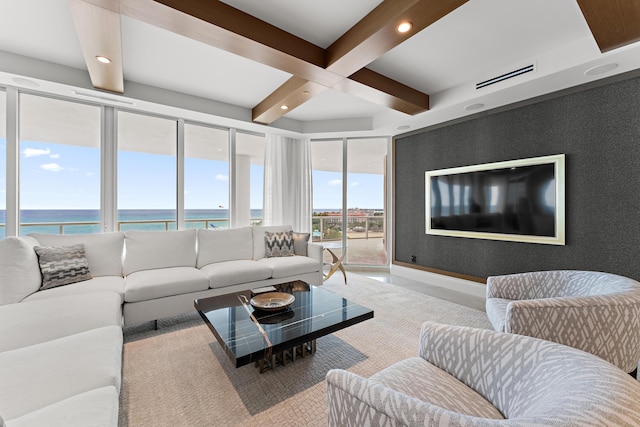 living room with beamed ceiling, a water view, and coffered ceiling