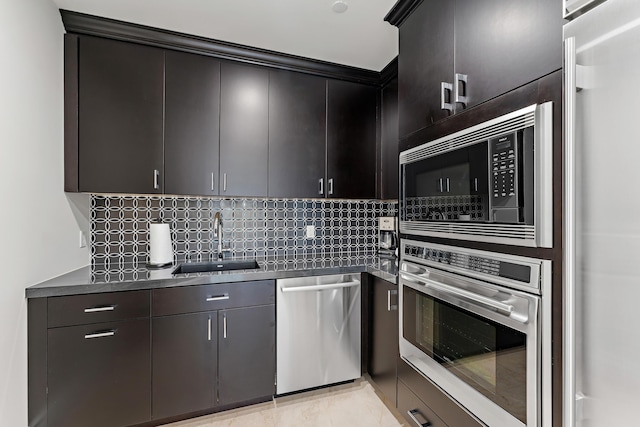 kitchen with decorative backsplash, sink, and stainless steel appliances