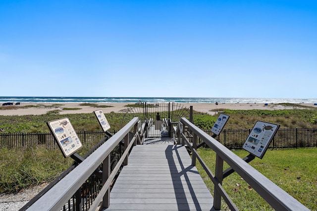 view of community with a view of the beach and a water view