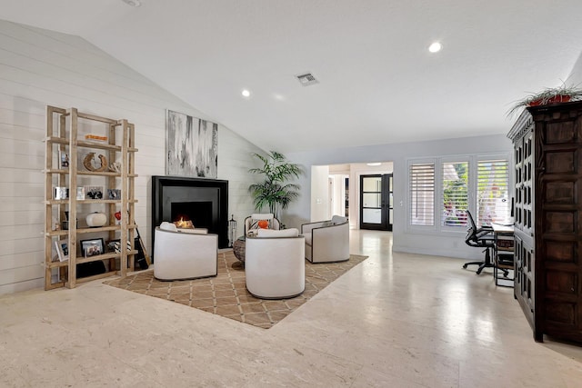 living room featuring lofted ceiling