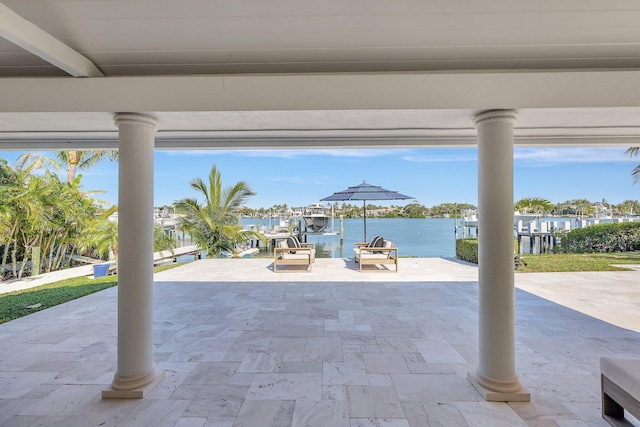 view of patio / terrace featuring a dock and a water view