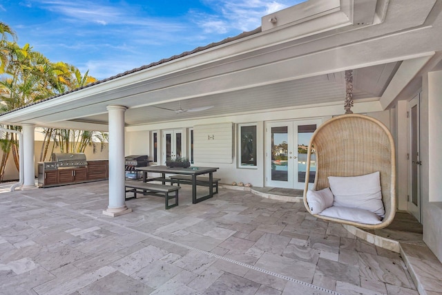 view of patio / terrace with area for grilling, a grill, french doors, and ceiling fan