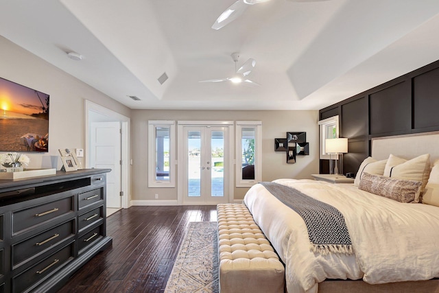 bedroom with access to outside, a raised ceiling, ceiling fan, and dark hardwood / wood-style floors