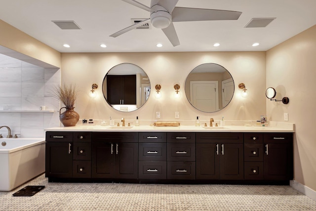 bathroom featuring ceiling fan, a tub to relax in, and vanity