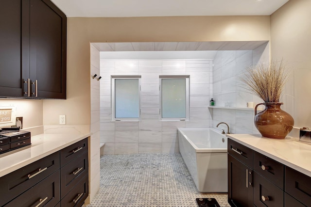 bathroom featuring a bathtub and vanity