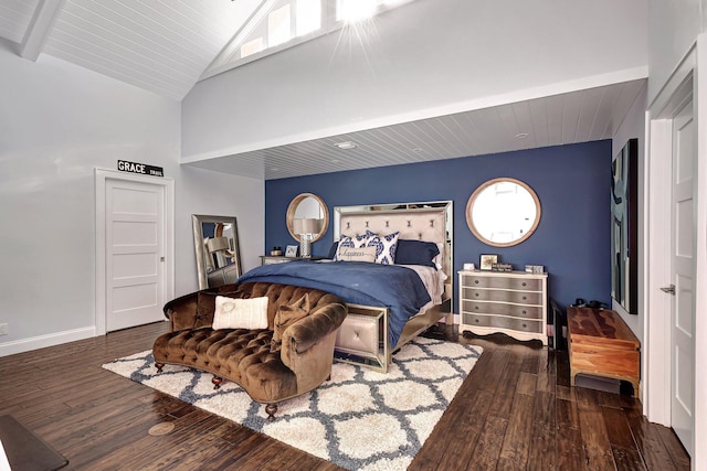 bedroom featuring beam ceiling, a towering ceiling, and dark hardwood / wood-style floors