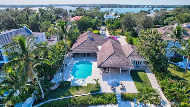 birds eye view of property with a water view