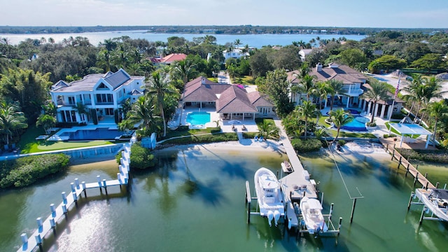 birds eye view of property with a water view