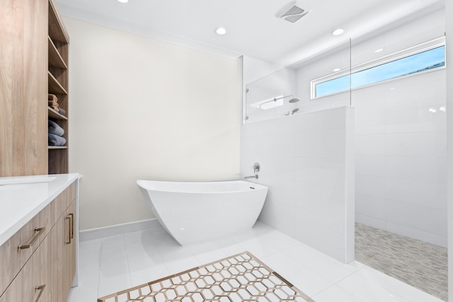 bathroom featuring tile patterned floors, vanity, and separate shower and tub