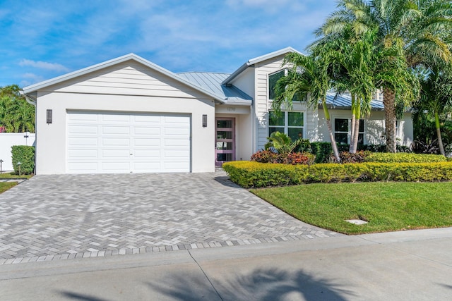 ranch-style home featuring a front yard and a garage