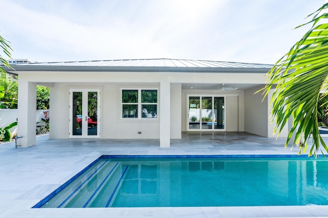 view of pool featuring ceiling fan and a patio area