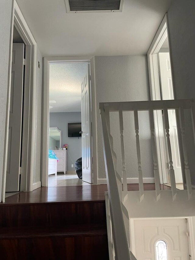 laundry room featuring ornamental molding, tile walls, and washer / clothes dryer