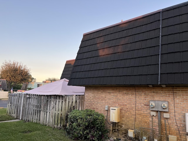 view of property exterior at dusk