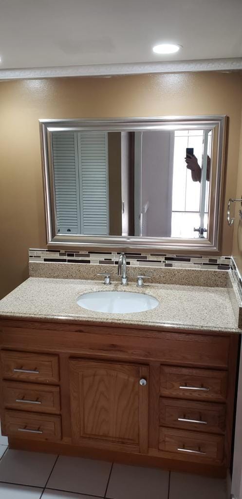 bathroom with tile patterned flooring and vanity