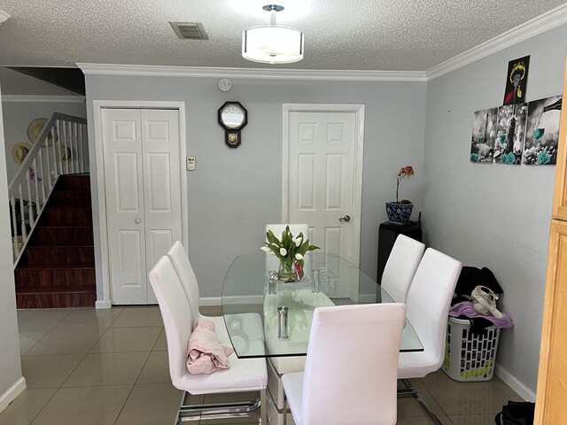 living room with ceiling fan, light tile patterned floors, and crown molding