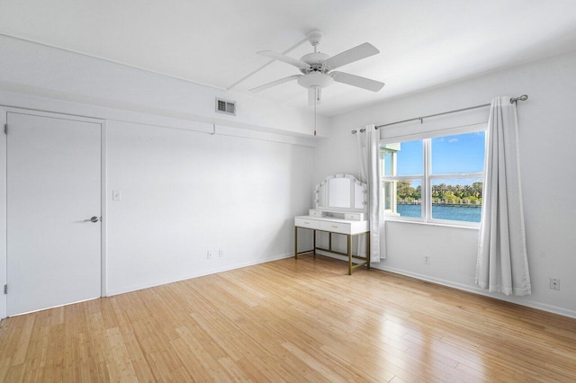 2772 NE 30th Ave Unit 8C, Lighthouse Point, FL 33064 - unfurnished room with light wood-type flooring, a ceiling fan, and baseboards