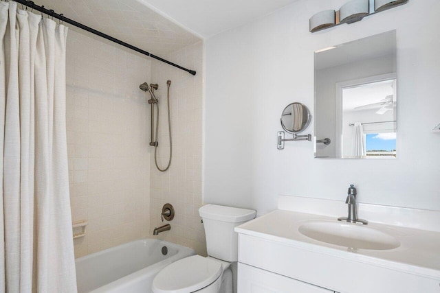 full bathroom featuring shower / tub combo with curtain, vanity, and toilet