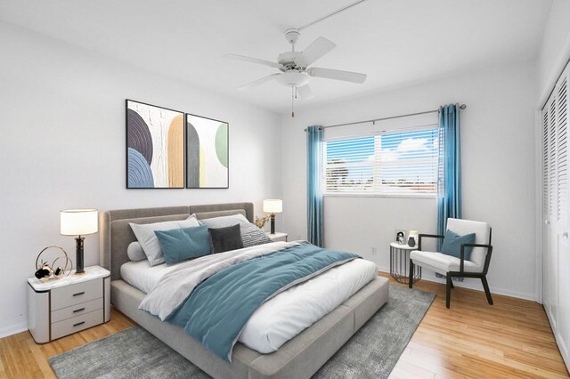 bedroom with ceiling fan, light hardwood / wood-style floors, and a closet