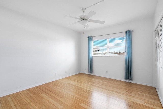 empty room featuring light hardwood / wood-style flooring and ceiling fan