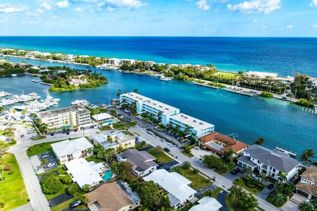 birds eye view of property with a water view