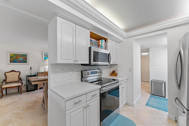 kitchen featuring white cabinets, crown molding, decorative backsplash, light tile patterned floors, and stainless steel appliances