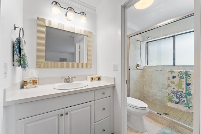 bathroom featuring vanity, toilet, a shower with door, and crown molding