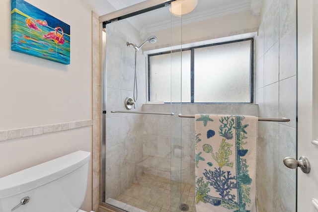 bathroom featuring toilet, an enclosed shower, and ornamental molding