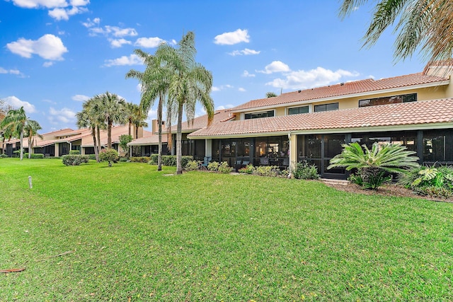 view of yard with a sunroom