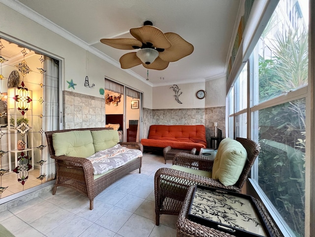 sunroom featuring ceiling fan