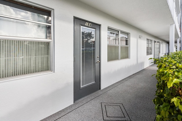 doorway to property featuring covered porch