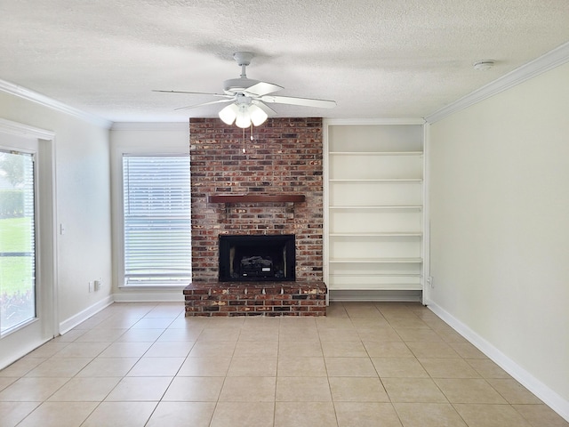 unfurnished living room featuring crown molding, a brick fireplace, ceiling fan, light tile patterned floors, and a textured ceiling