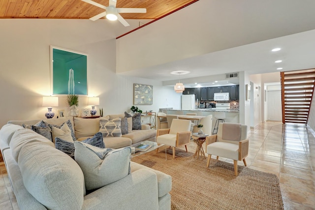 living room featuring lofted ceiling, ceiling fan, and wood ceiling