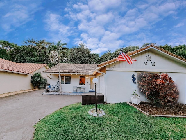 402 Shadow Wood Ln, Coral Springs, FL 33071 - mediterranean / spanish home featuring a porch and a front lawn