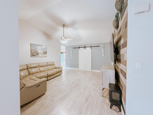 402 Shadow Wood Ln, Coral Springs, FL 33071 - living room with a barn door, ceiling fan, vaulted ceiling, and hardwood / wood-style flooring