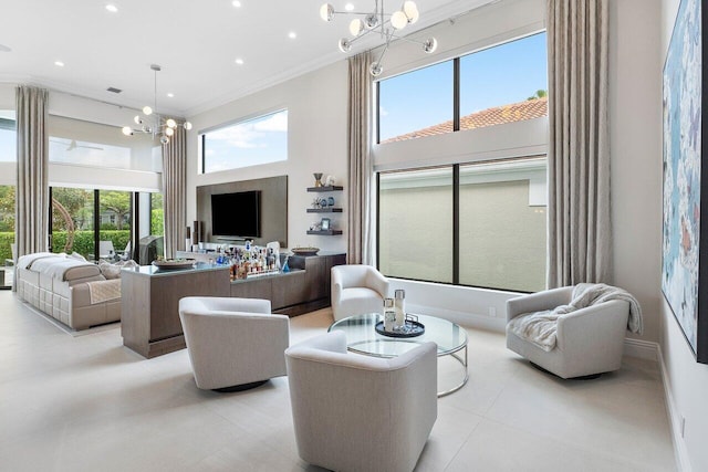 tiled living room featuring plenty of natural light, crown molding, and a chandelier