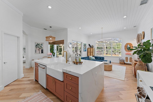 kitchen with light stone countertops, wood ceiling, pendant lighting, a large island with sink, and dishwasher