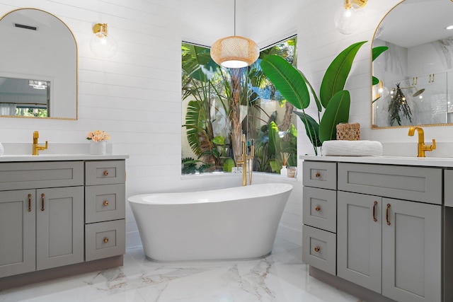 bathroom featuring shower with separate bathtub and vanity