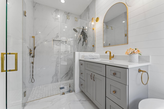 bathroom with vanity, walk in shower, and wooden walls