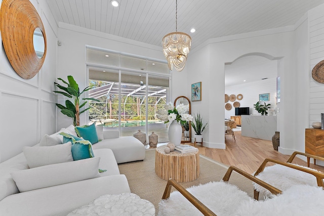 living room featuring light wood-type flooring, wood ceiling, and an inviting chandelier