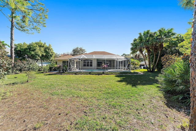 view of yard featuring glass enclosure