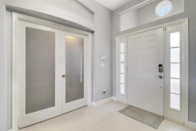 entryway with light tile patterned flooring