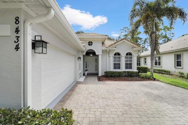 entrance to property featuring a garage