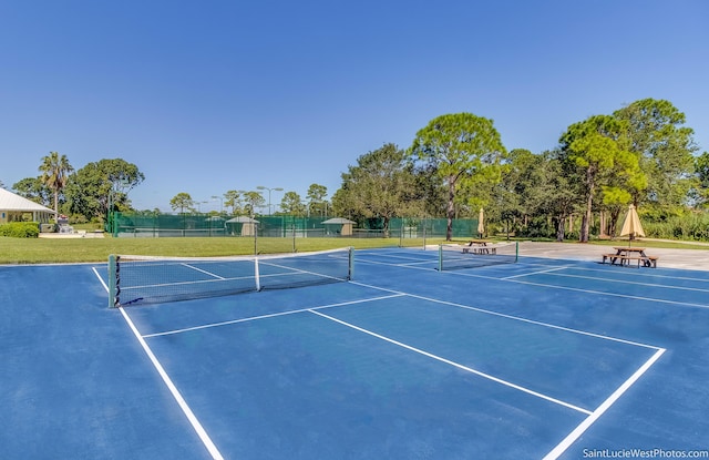 view of tennis court featuring basketball court