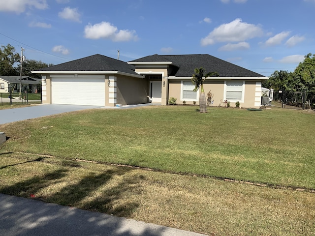 view of front facade featuring a front yard and a garage